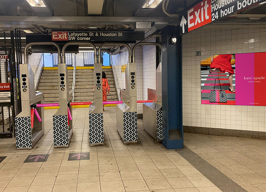 Subway turnstiles wrapped with Kate Spade creative